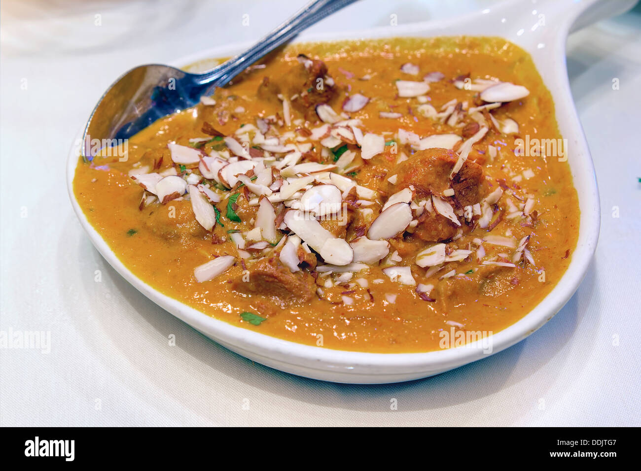 East Indian Food Lamb Curry Korma with Sliced Almonds Closeup Stock Photo