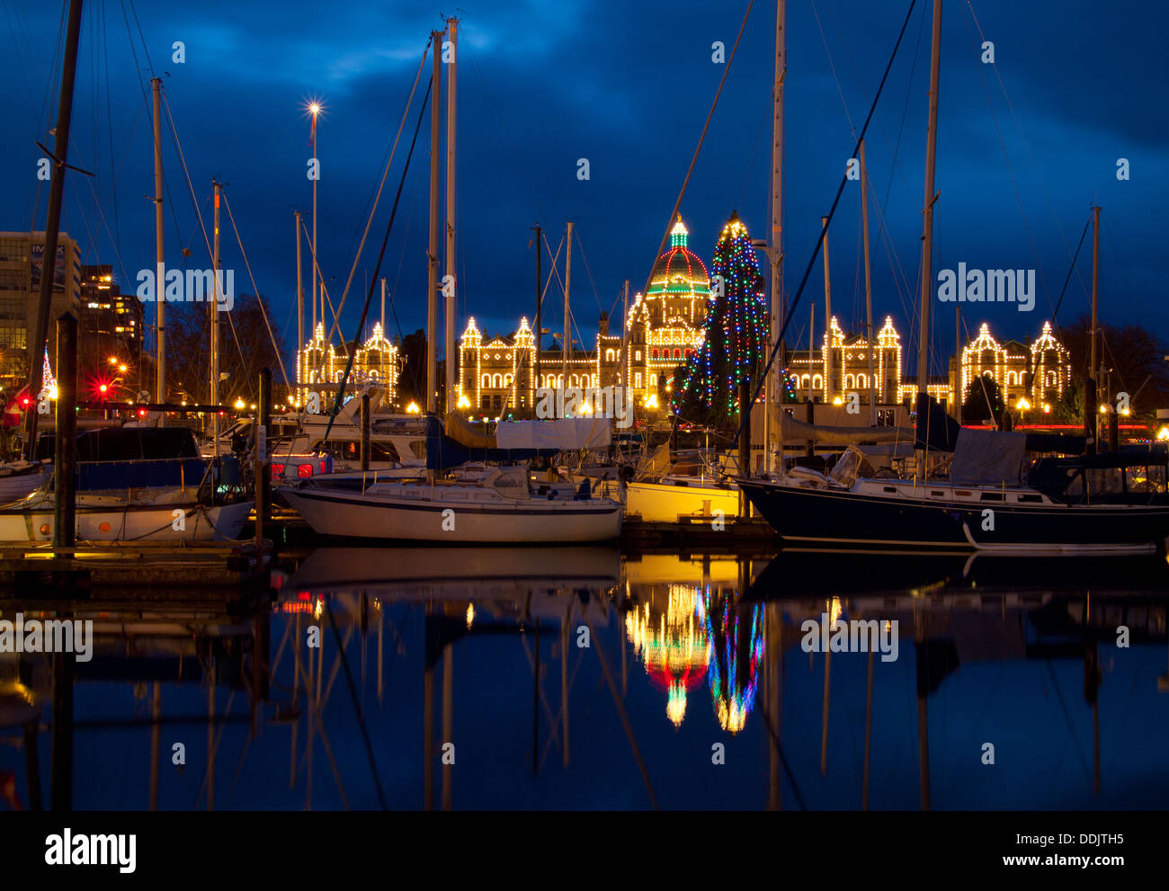 A night, blue hour view of the gorgeous Inner Harbour at Christmas in Victoria, British Columbia, Canada. Stock Photo