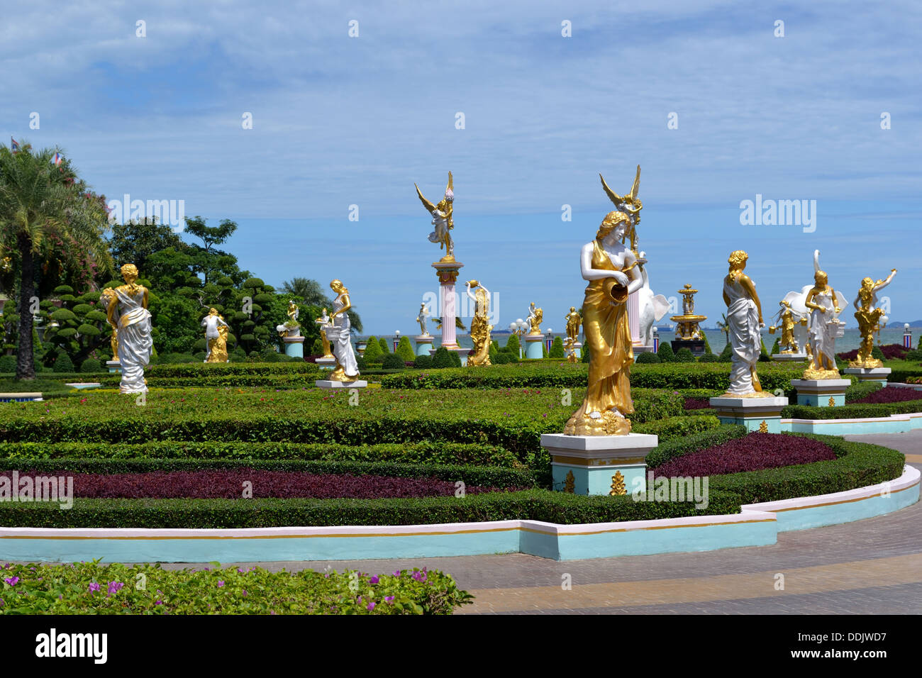 Golden Statues in garden of Sukhawadee Mansion - Colourful building Pattaya Stock Photo
