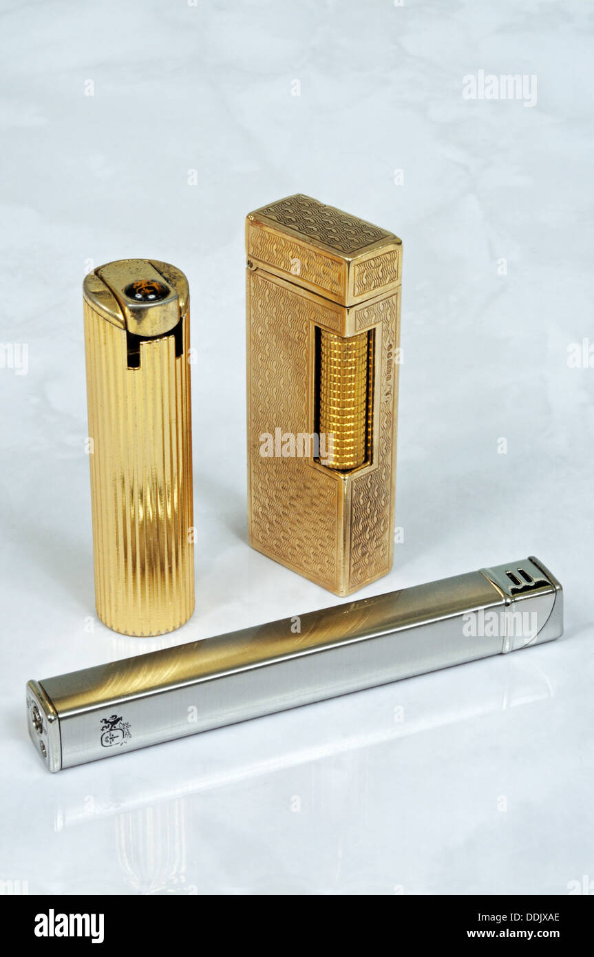 Chrome Colibri, Dunhill gold, and Gold Colibri cigarette lighters, England, UK, Western Europe. Stock Photo