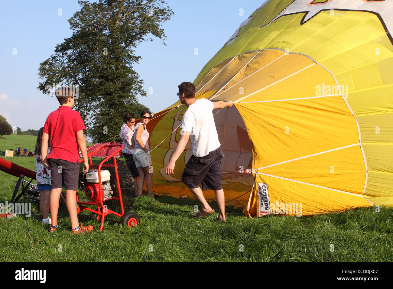 Preparing to launch a hot air balloon by blowing in air to fill the