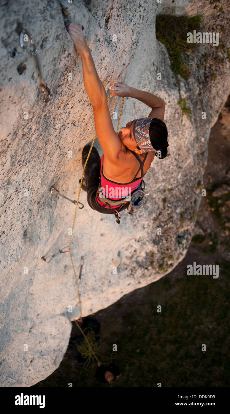 Elevated view of female sport climber. Rock climbing in Jura Krakowsko Czestochowska. Rzędkowice. Central Poland. Stock Photo