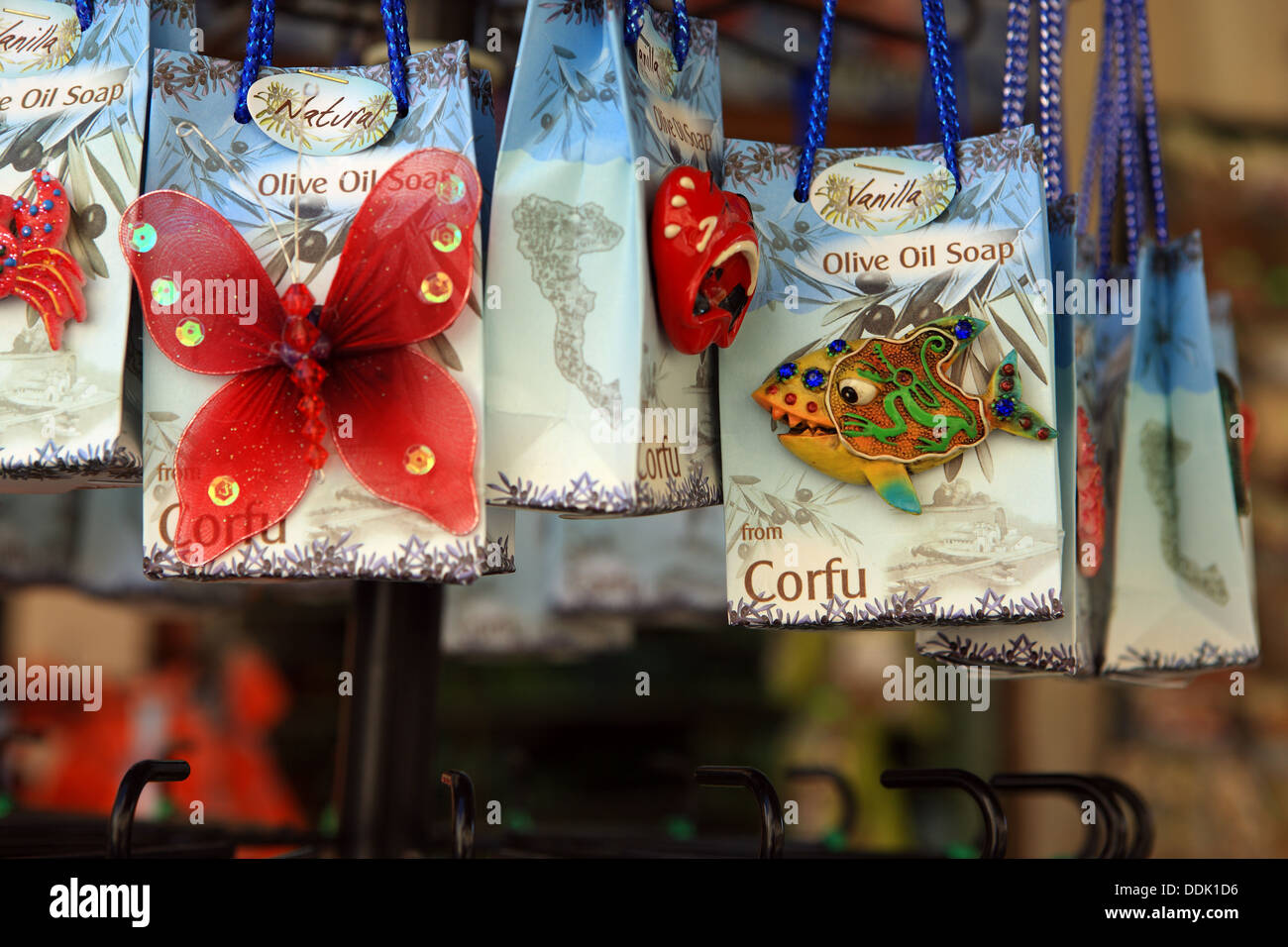 Pretty souvenir or gift bags of Olive Oil soap hanging from a shop display in Corfu Town Stock Photo