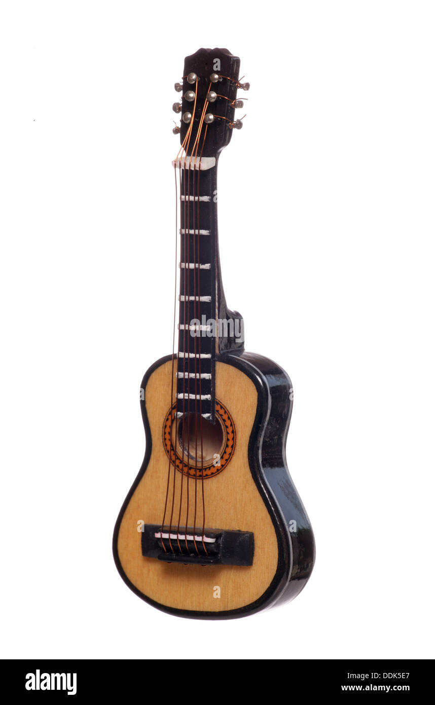 Miniature acoustic guitar studio cutout Stock Photo