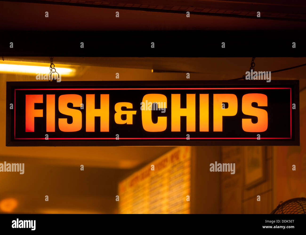 Fish and chip shop neon sign at night Stock Photo