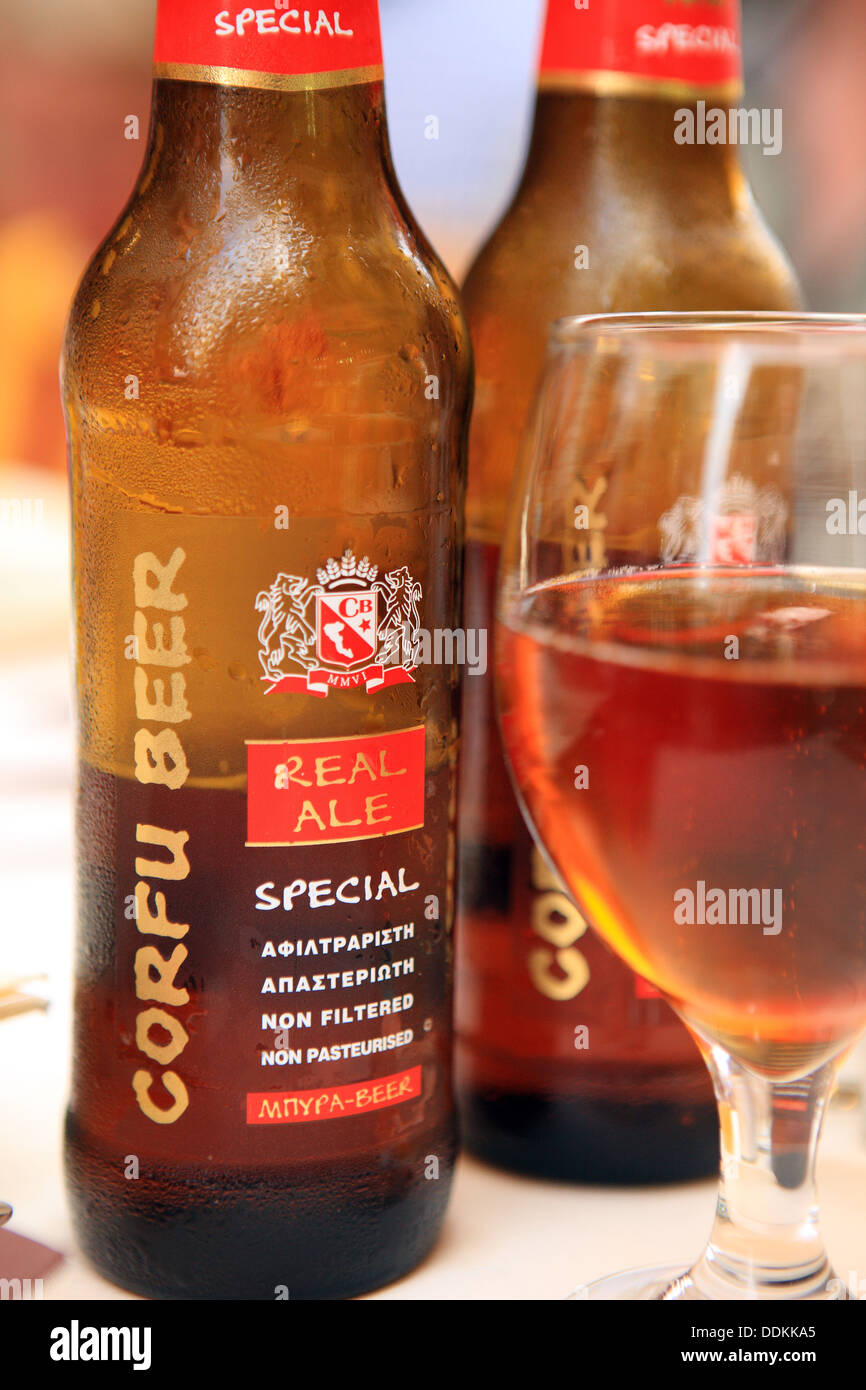 Bottles and a glass of Corfu Beer, real ale brewed at Arillas on the Greek Island Stock Photo