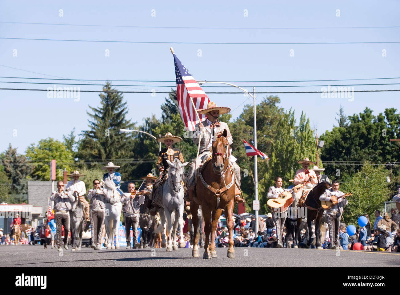 Horse riding band leader of a Mexican mariachi band parading Pearl Street, Ellensburg Rodeo Western Parade, WA, USA Stock Photo