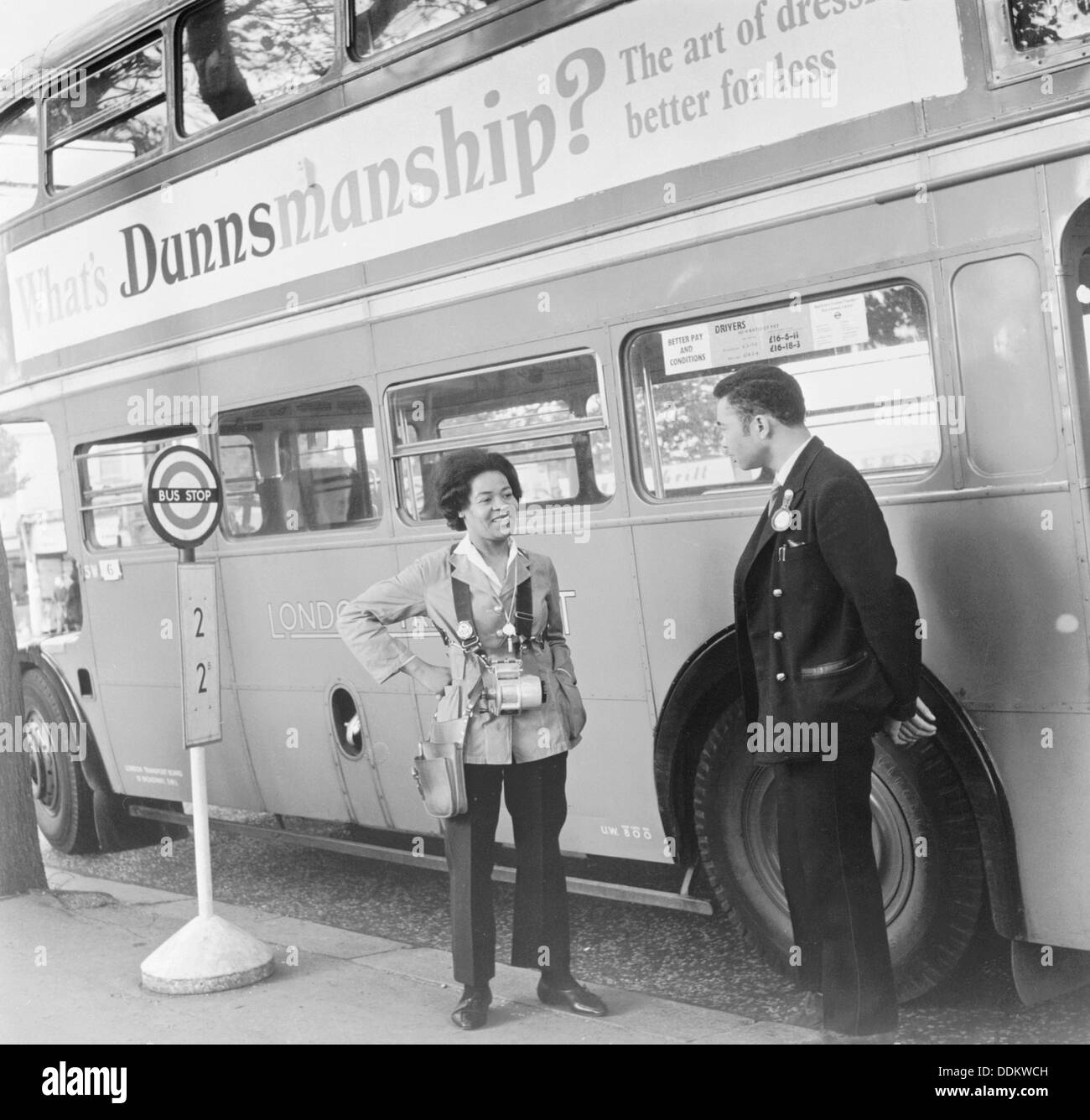 Bus conductress and driver at Crystal Palace, Sydenham, London, 1962. Artist: Henry Grant Stock Photo
