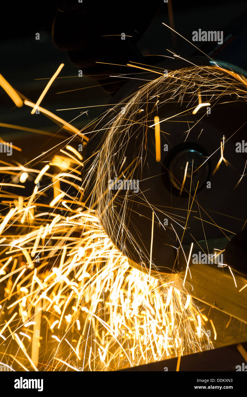 sharpening and cutting of iron by abrasive disk machine Stock Photo - Alamy