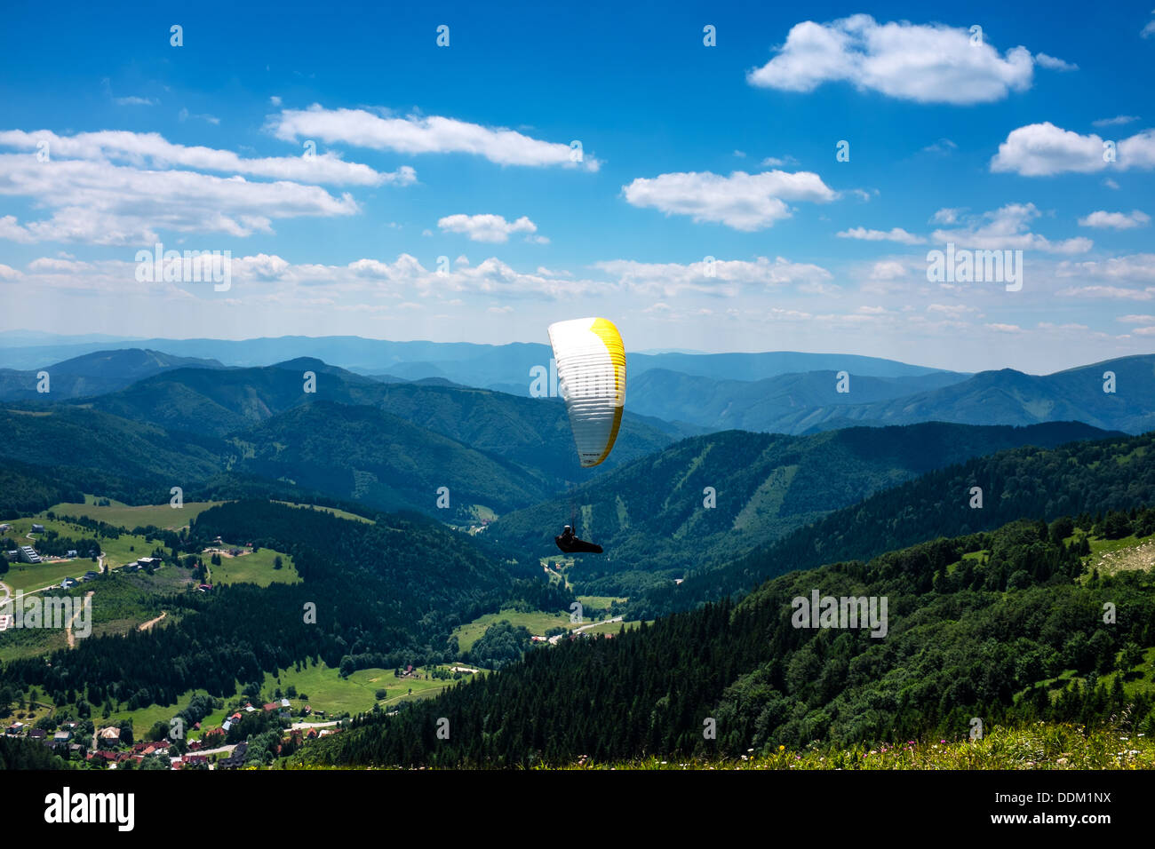 Paraglider flying over Velka Fatra, Donovaly in Slovakia Stock Photo