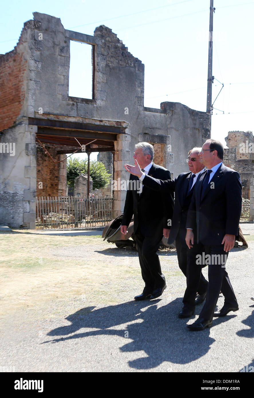 Oradour-sur-Glane, France. 04th Sep, 2013. German President Joachim Gauck (L), French President Francois Hollande (R) and survivor of the massacre in Oradour-sur-Glane during World War II Robert Hebras (R) are pictured at the memorial site in Oradour-sur-Glane, France, 04 September 2013. A unit of SS officers murdered 642 citizens of the town in June 1944. The German President is on a three-day visit to France. Photo: WOLFGANG KUMM/dpa/Alamy Live News Stock Photo