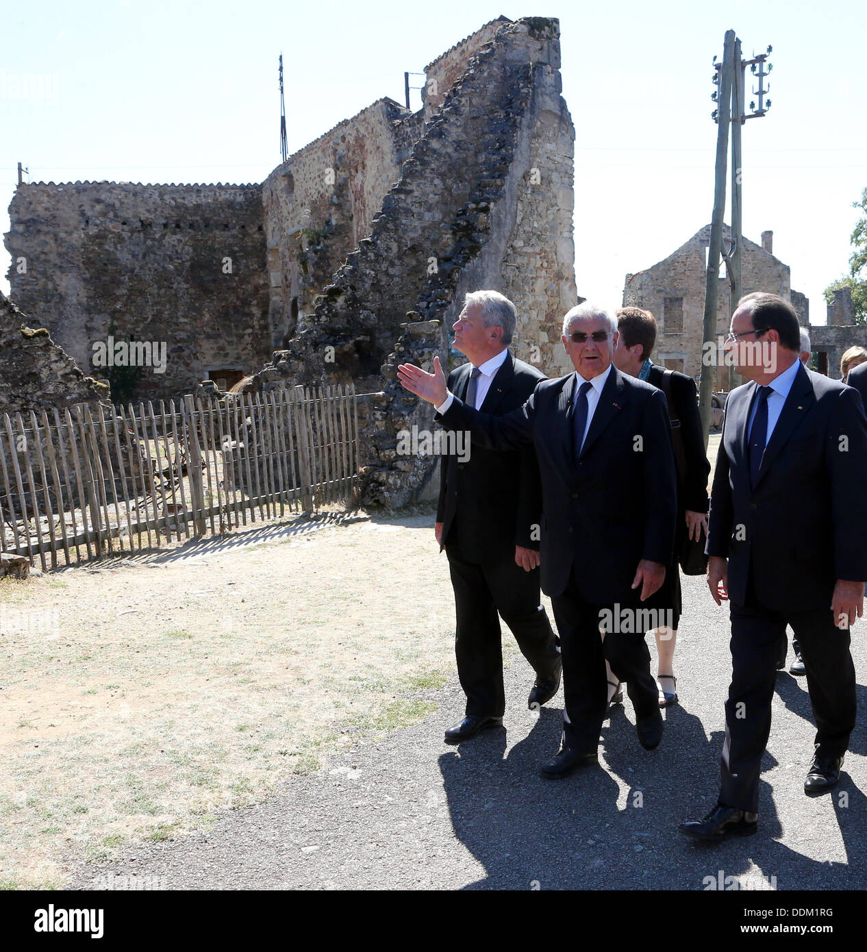 Oradour-sur-Glane, France. 04th Sep, 2013. German President Joachim Gauck (L), French President Francois Hollande and survivor of the massacre in Oradour-sur-Glane during World War II Robert Hebras (R) are pictured at the memorial site in Oradour-sur-Glane, France, 04 September 2013. A unit of SS officers murdered 642 citizens of the town in June 1944. The German President is on a three-day visit to France. Photo: WOLFGANG KUMM/dpa/Alamy Live News Stock Photo