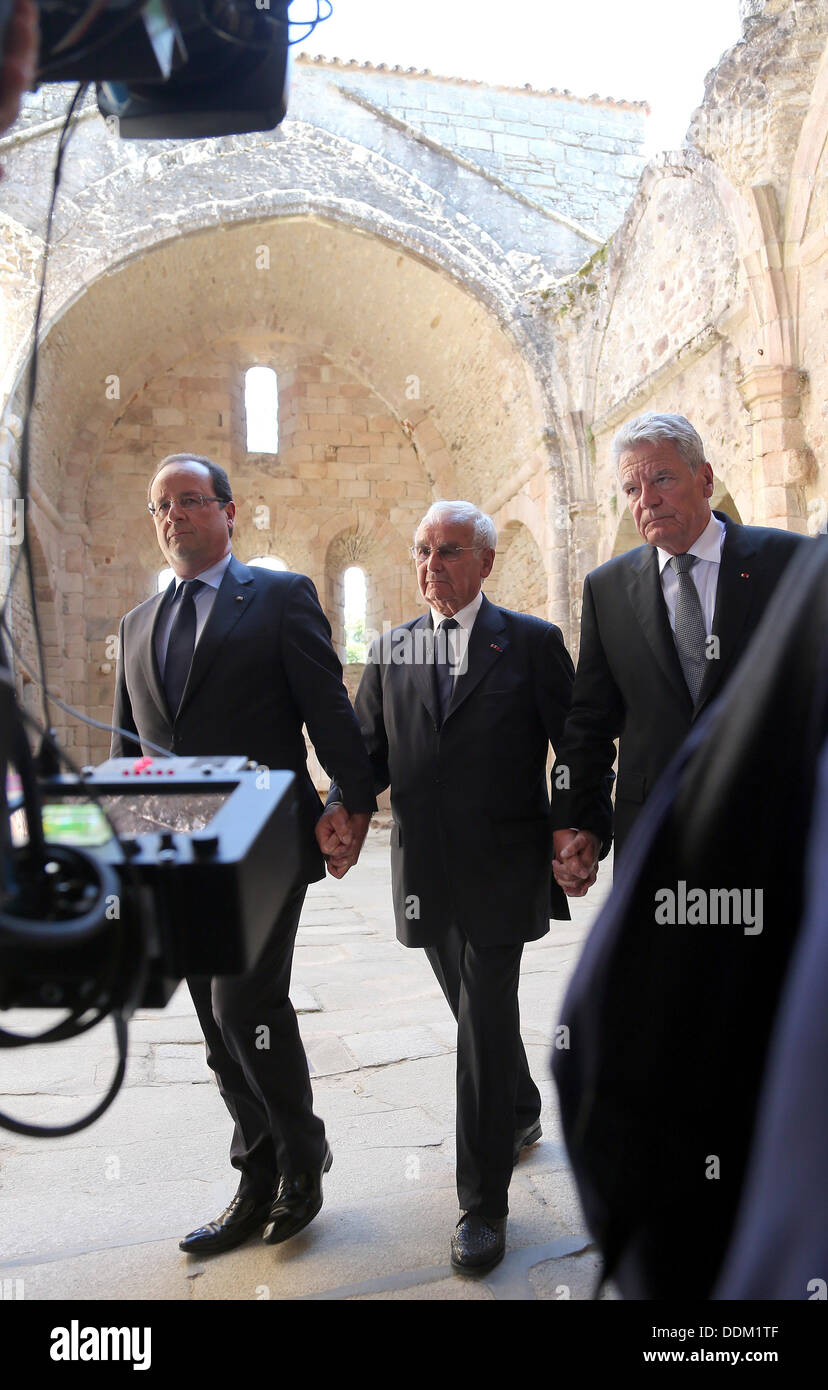 Oradour-sur-Glane, France. 04th Sep, 2013. German President Joachim Gauck (R), French President Francois Hollande (L) and survivor of the massacre in Oradour-sur-Glane during World War II Robert Hebras (C) are pictured at the memorial site in Oradour-sur-Glane, France, 04 September 2013. A unit of SS officers murdered 642 citizens of the town in June 1944. The German President is on a three-day visit to France. Photo: WOLFGANG KUMM/dpa/Alamy Live News Stock Photo