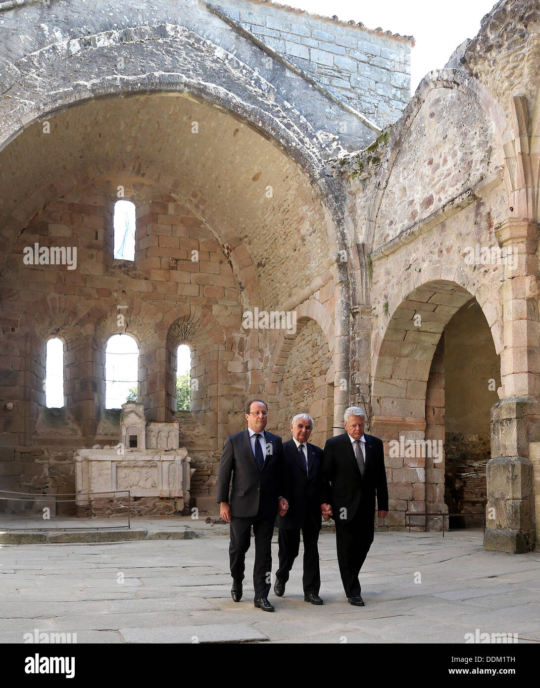 Oradour-sur-Glane, France. 04th Sep, 2013. German President Joachim Gauck (R), French President Francois Hollande (L) and survivor of the massacre in Oradour-sur-Glane during World War II Robert Hebras (C) are pictured at the memorial site in Oradour-sur-Glane, France, 04 September 2013. A unit of SS officers murdered 642 citizens of the town in June 1944. The German President is on a three-day visit to France. Photo: WOLFGANG KUMM/dpa/Alamy Live News Stock Photo