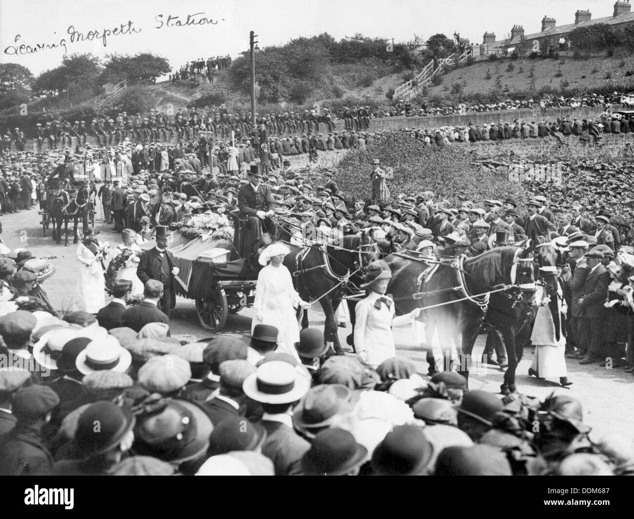 A large crowd watches Emily Wilding Davison's funeral procession 15th June 1913. Artist: Unknown Stock Photo