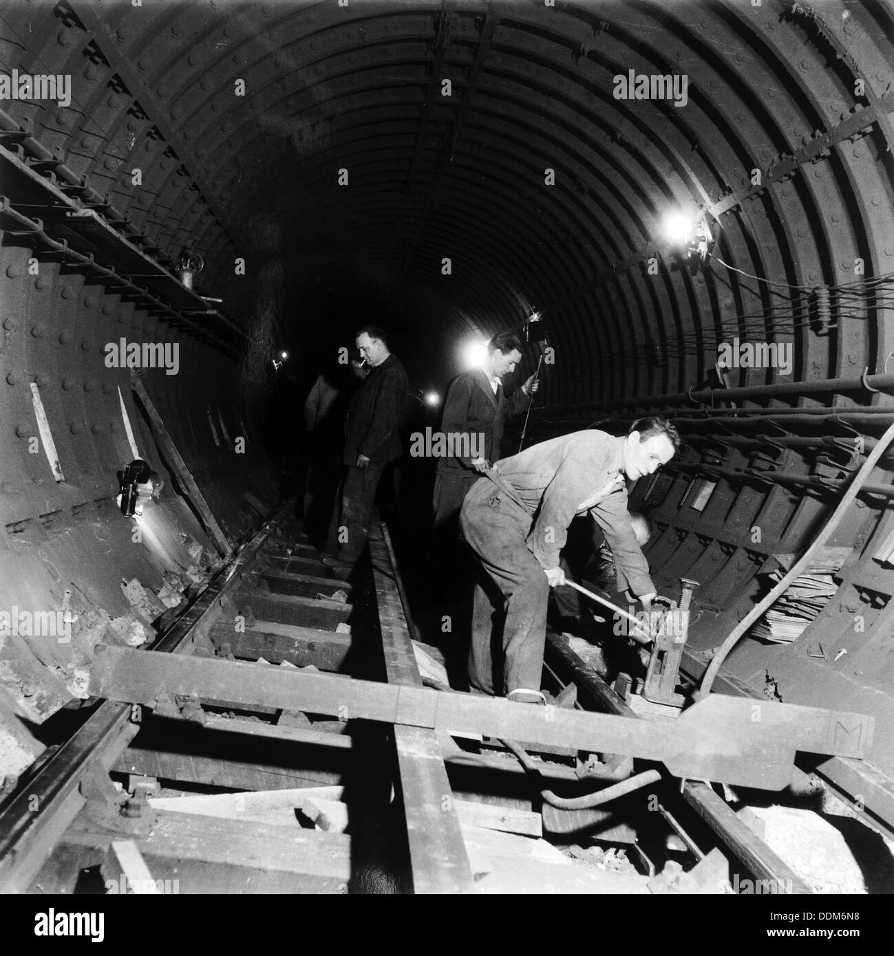 Repairing underground train tracks, London, 1955. Artist: Henry Grant Stock Photo