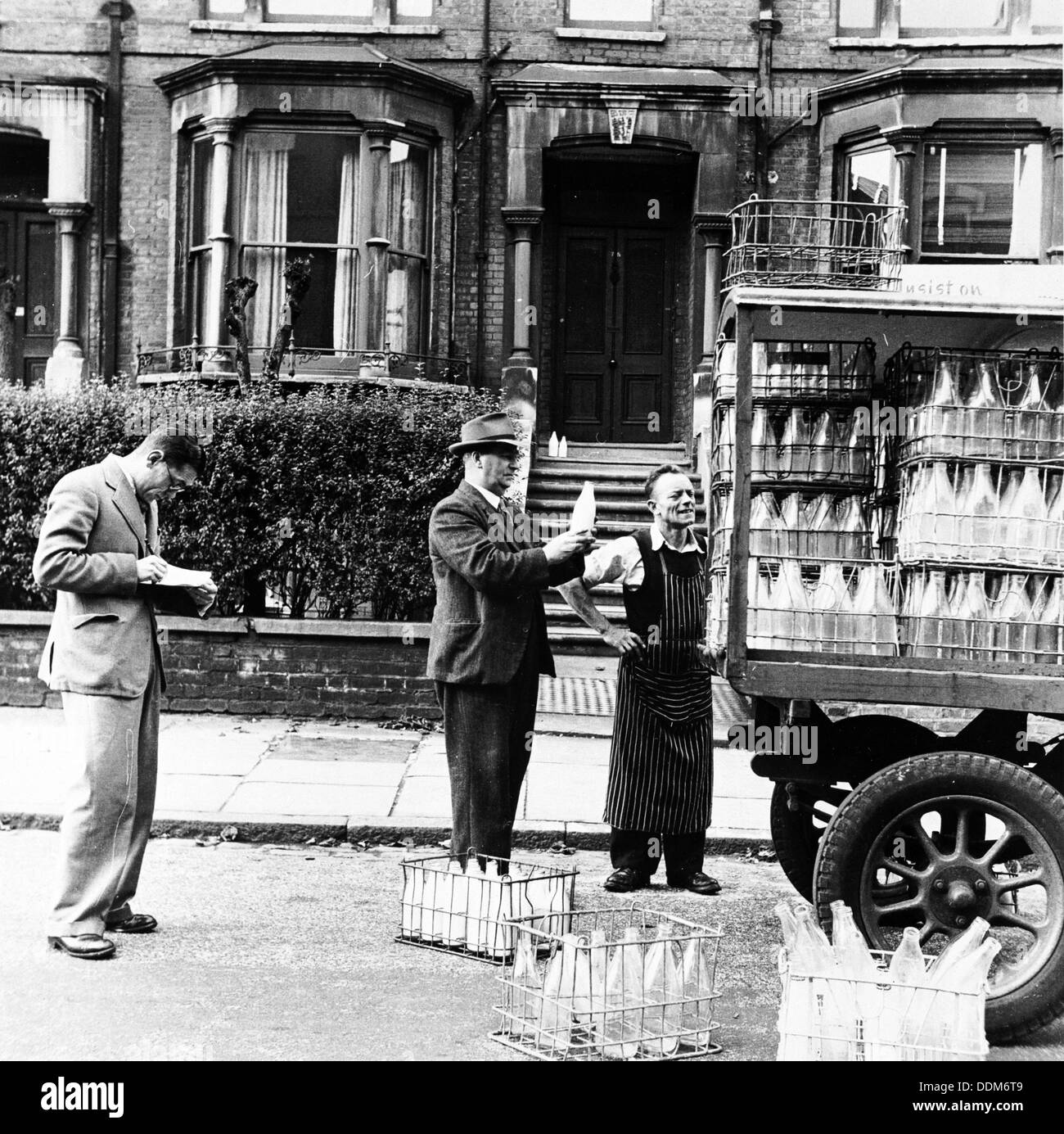 A milkman on his rounds in London, c1950s. Artist: Henry Grant Stock Photo