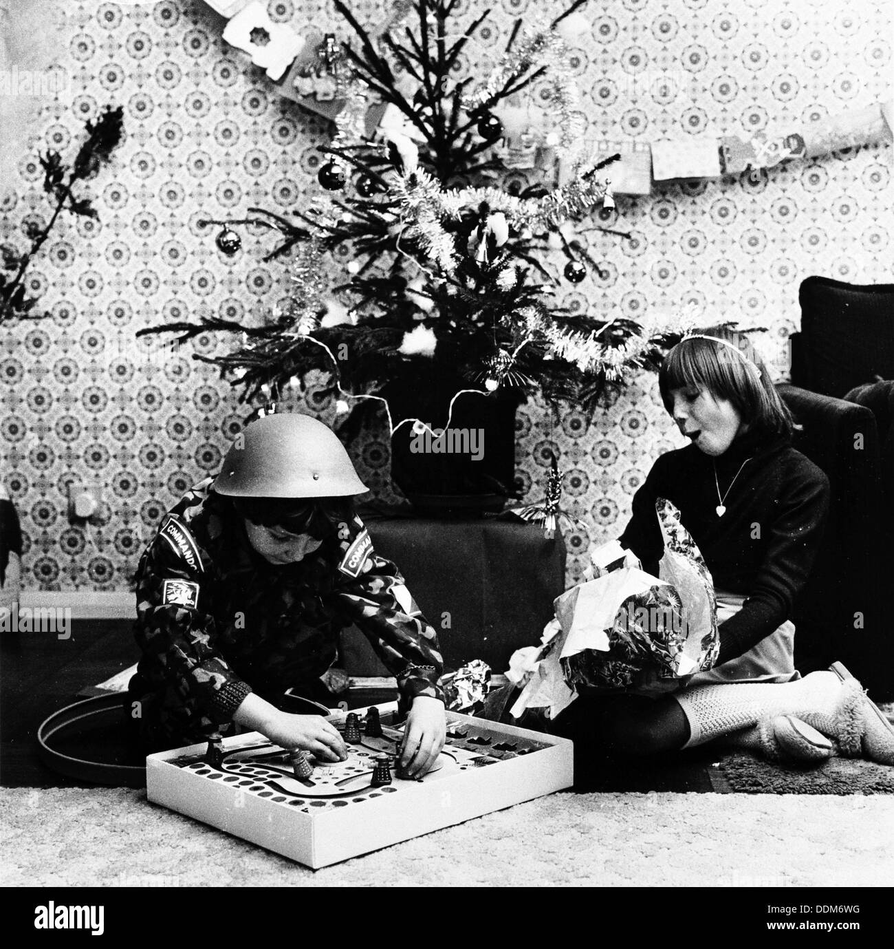 Children opening Christmas presents in their London home, c1960s. Artist: Henry Grant Stock Photo