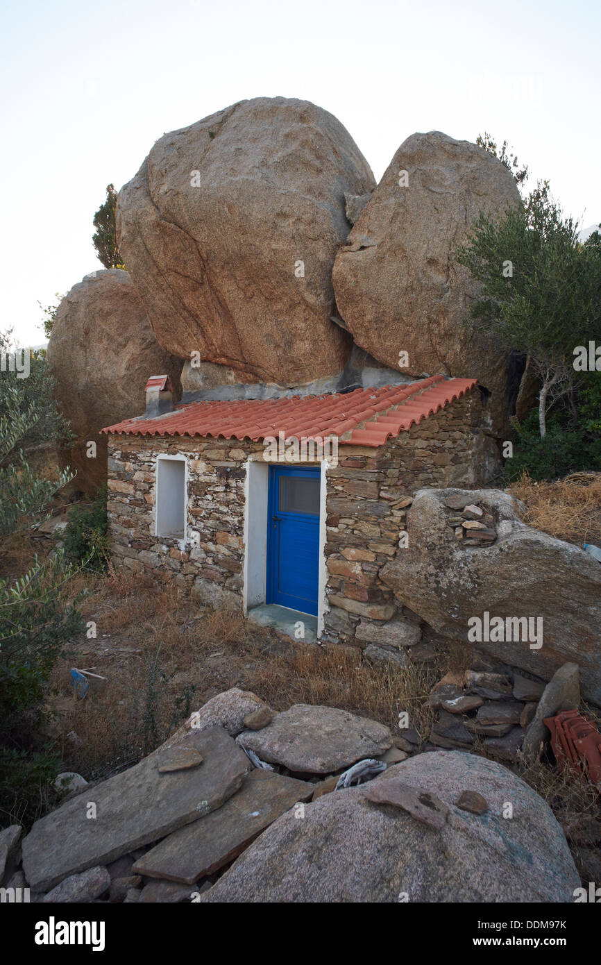 A traditional house built under a volcanic rock, Manganitis, Ikaria ...