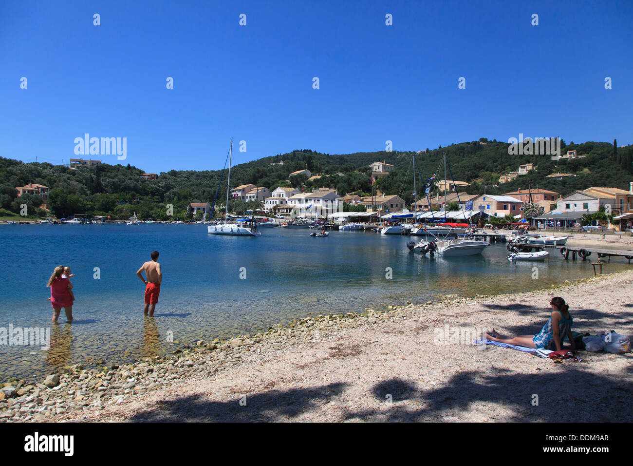 Turisuts paddling in thew sea at Agios Stephanos in North East Corfu Stock Photo