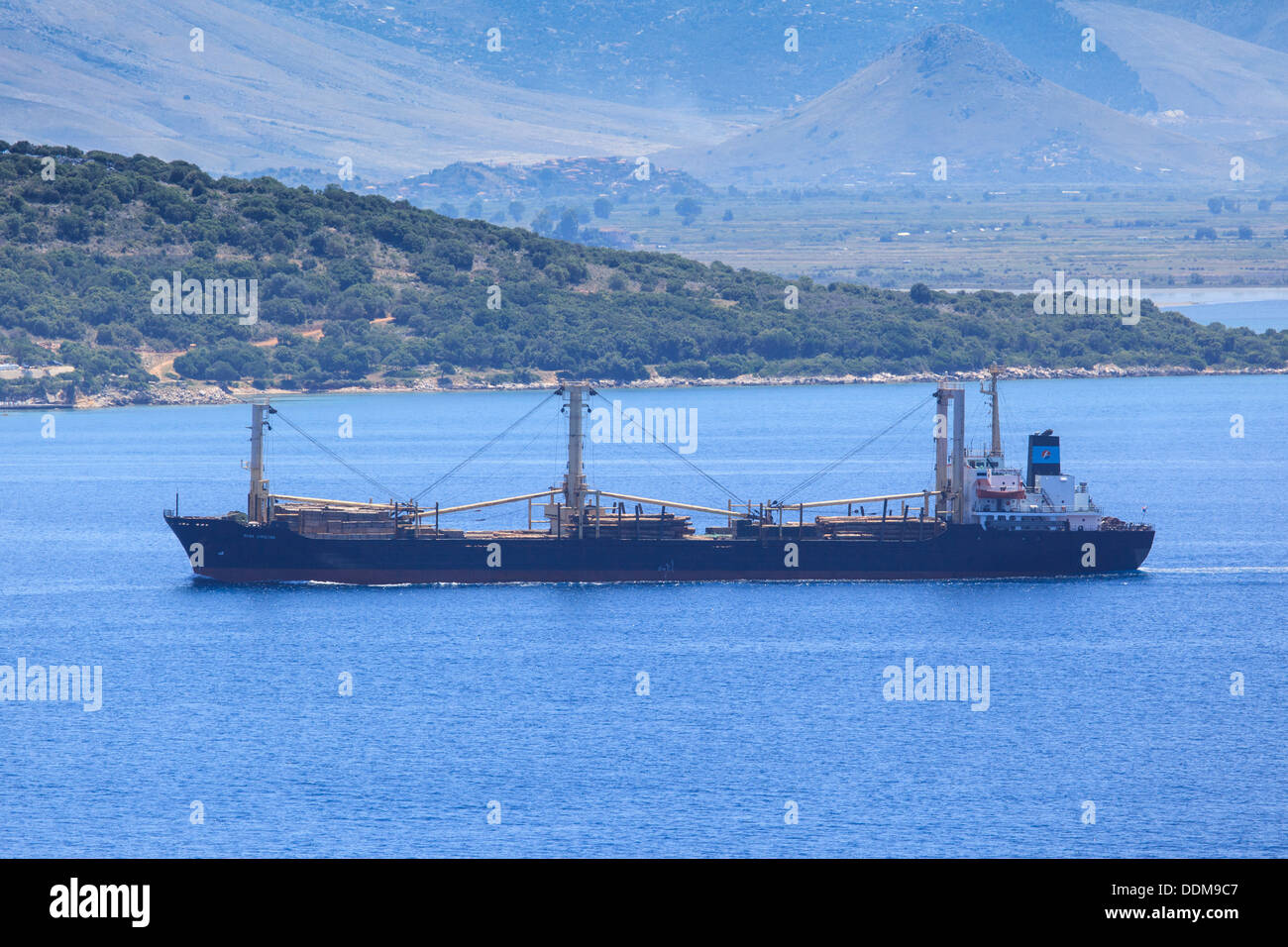 The cargo ship Reina Christina carrying timber in the straits between Corfu and Albania Stock Photo