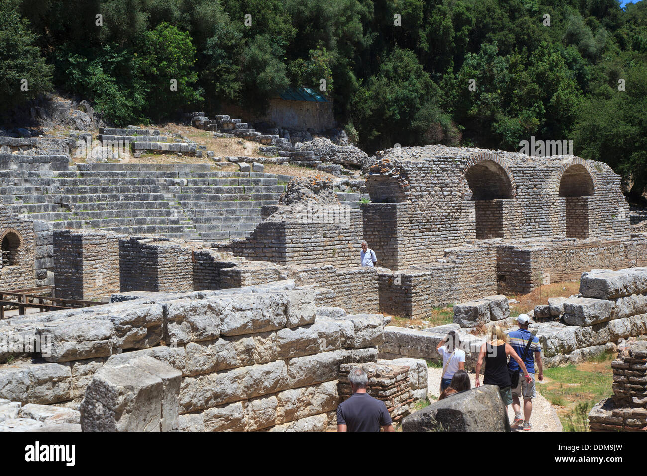 Tourists walking through the remains of the ancient Greek and Roman town at Butrint Albania Stock Photo