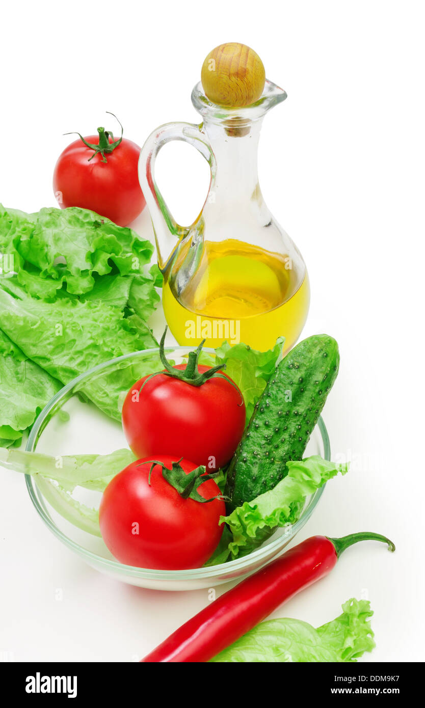 Set vegetable and jug of vegetable oil isolated on the white background