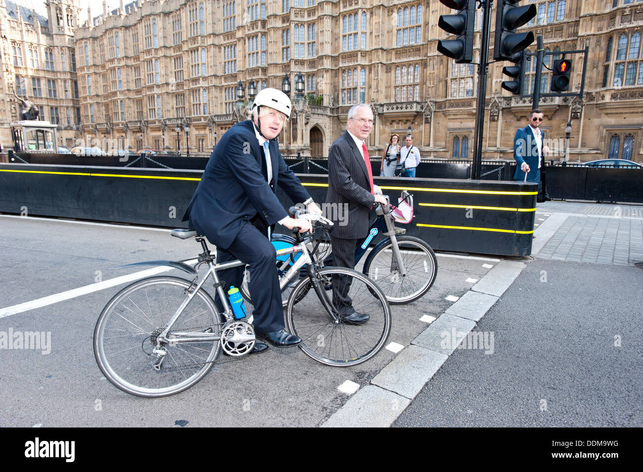 London, UK - 4 September 2013: the Mayor of London Boris Johnson and the London’s Transport Commissioner, Sir Peter Hendy, ride their bikes in Westminster after unveiling a number of measures to tackle Heavy Goods Vehicle (HGV) safety as part of a joint effort to boost cycling in the capital. Credit:  Piero Cruciatti/Alamy Live News Stock Photo