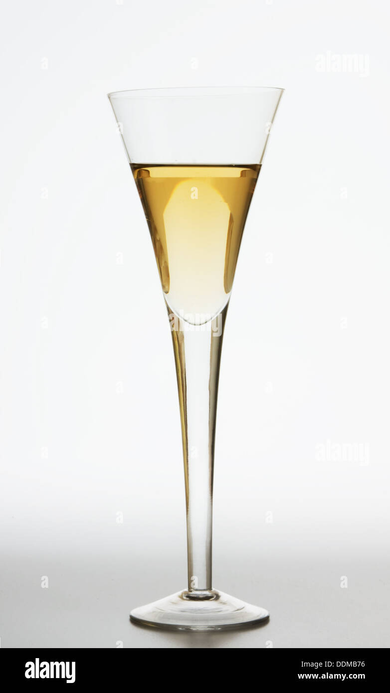 full wine glass of champagne in backlit Stock Photo