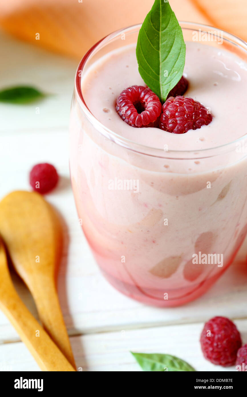 raspberry smoothie milk in a transparent glass, close up Stock Photo
