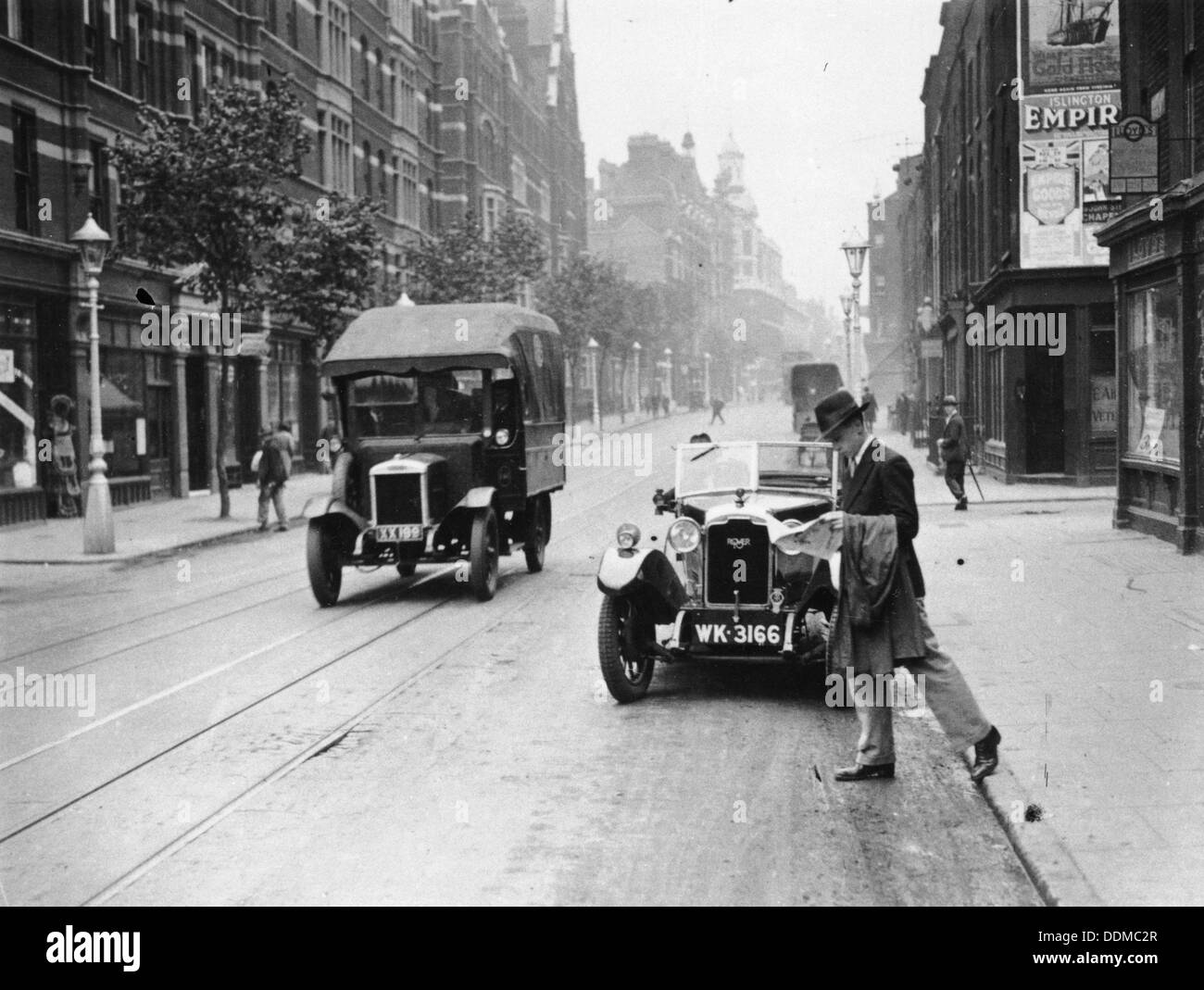 A Rover 1928 10/25 HP sports car parked in a London street, 1931. Artist: Unknown Stock Photo