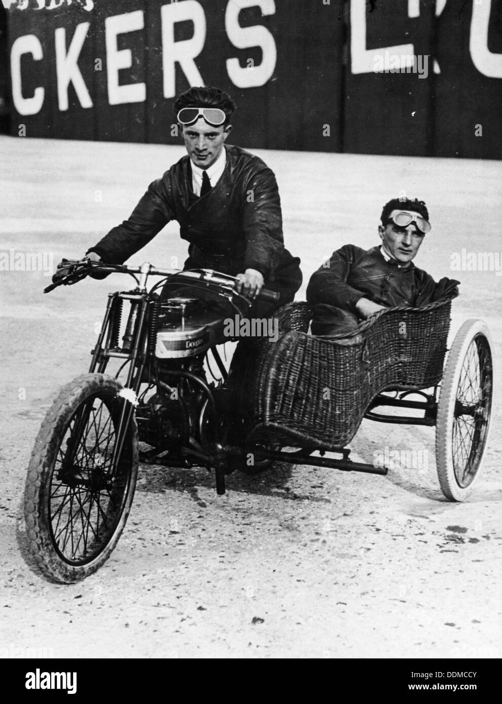 Tudor and Thompson riding a motorcycle and sidecar. Artist: Unknown Stock Photo