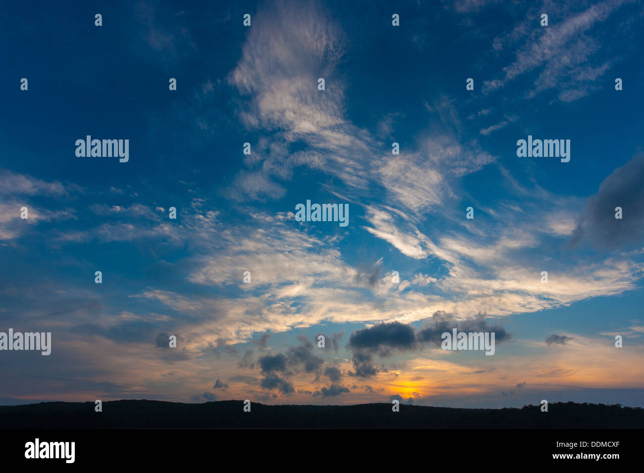 dramatic sky with clouds at sunset over Stock Photo - Alamy