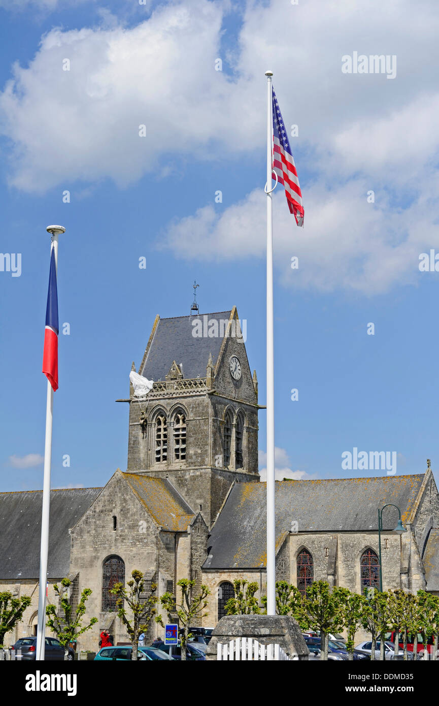 The church at Sainte-Mère-Église, Normandy, with the dummy of the American paratrooper John Steele hanging from the church spire Stock Photo