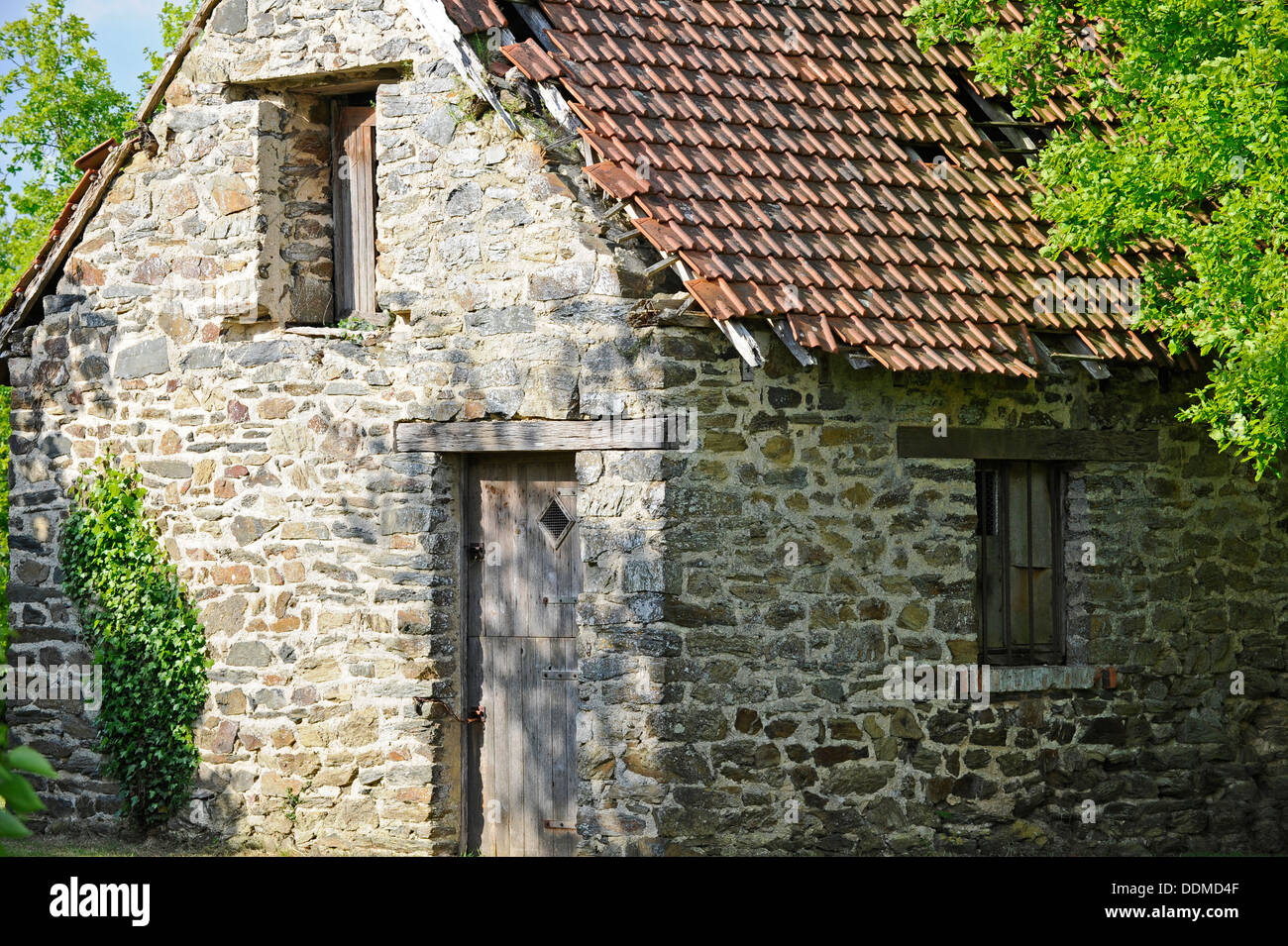 Traditional stone built barn and roman style roof tiles, Stock Photo