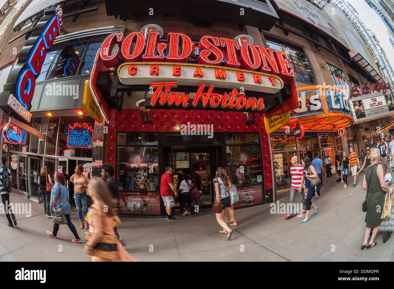 A Cold Stone Creamery store, with a Tim Horton's coffee franchise inside, in Times Square in New York Stock Photo
