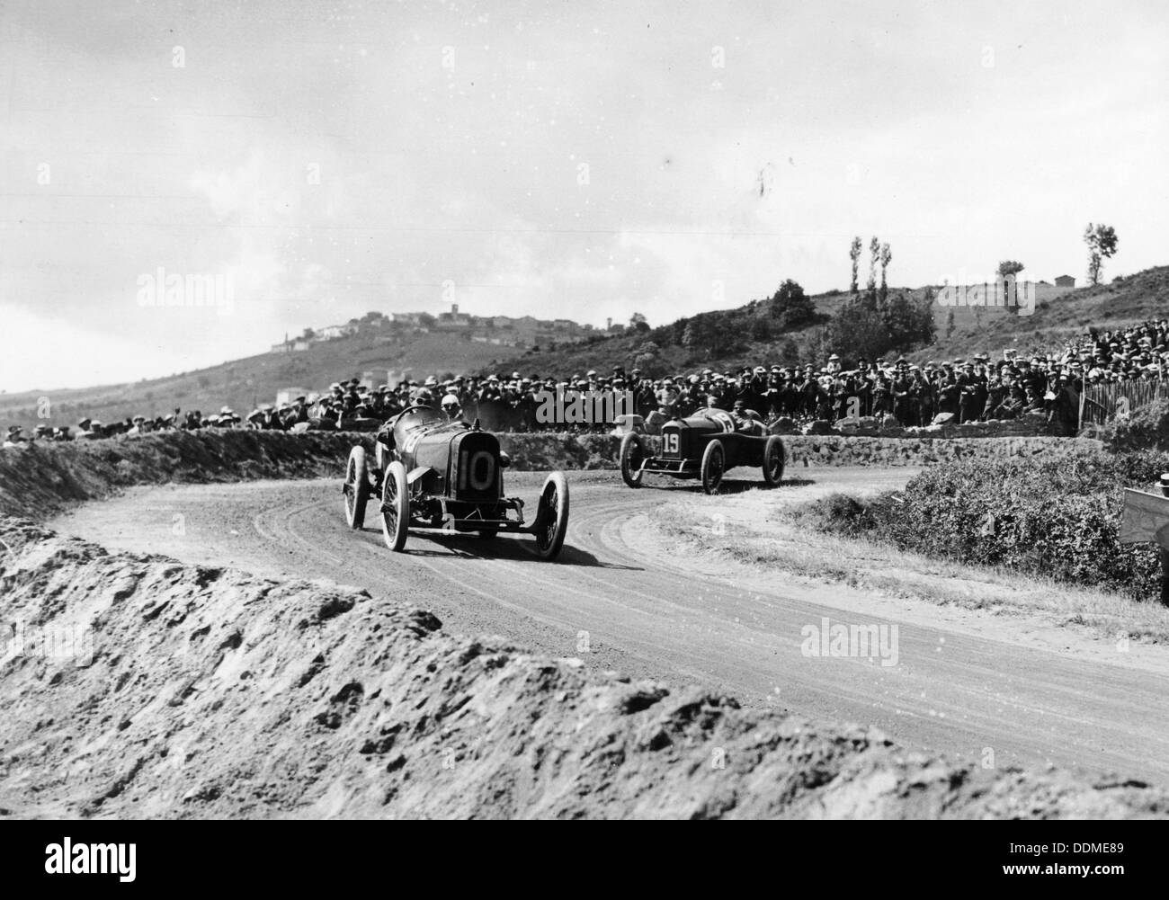 J Chassagne in the Sunbeam leading Jules Goux in the Peugeot, French Grand Prix, Lyons, 1914. Artist: Unknown Stock Photo