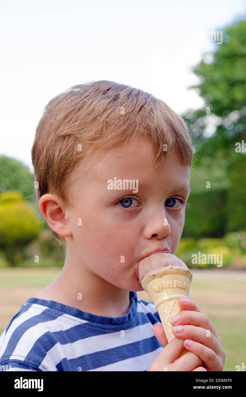 Boy licking ice cream cone hires stock photography and images Alamy