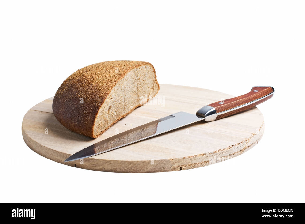 Bread and bread knife on a table in a … – Ottieni la licenza per le foto –  402188 ❘ StockFood