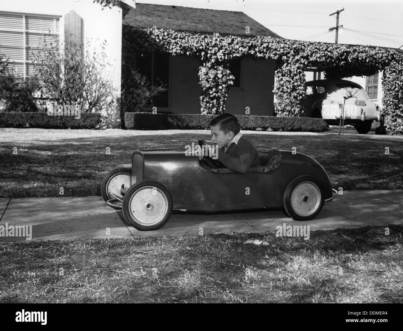 Boy in a pedal car. Artist: Unknown Stock Photo - Alamy