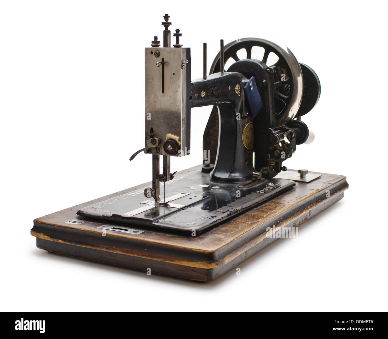 Old sewing machine isolated on a white background Stock Photo - Alamy