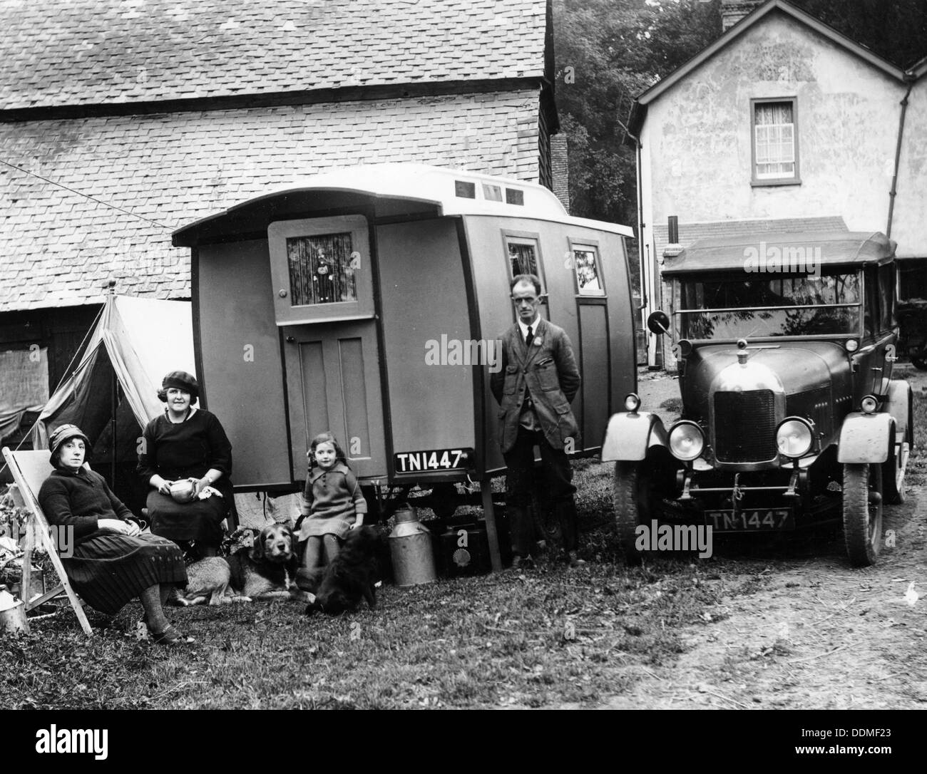 Family group with a 1925 Morris Oxford 14/28 and caravan, (Eccles, c1926?). Artist: Unknown Stock Photo