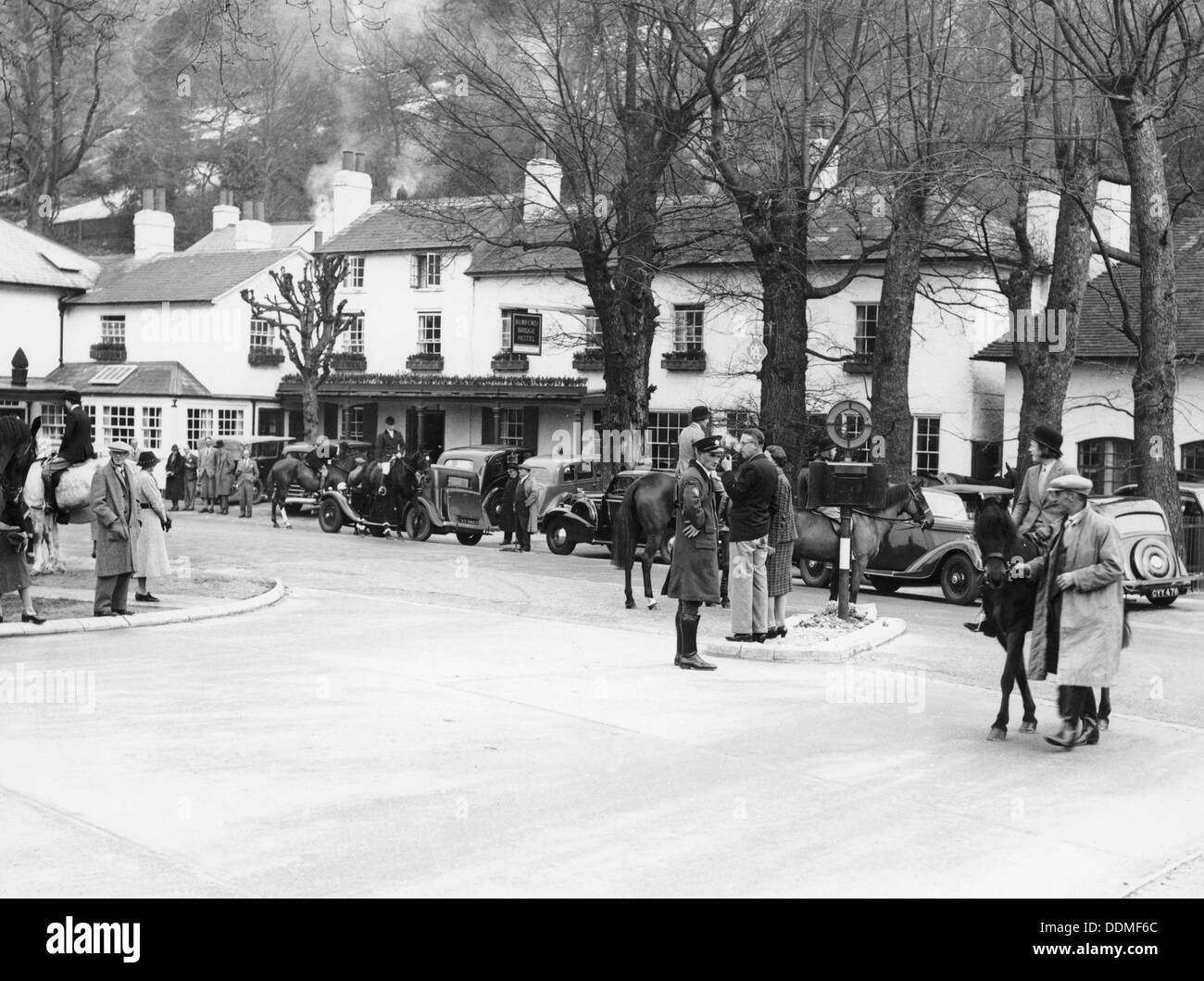 Pedestrians and riders outside the Burford Bridge Hotel, Surrey, (c1930s?). Artist: Unknown Stock Photo