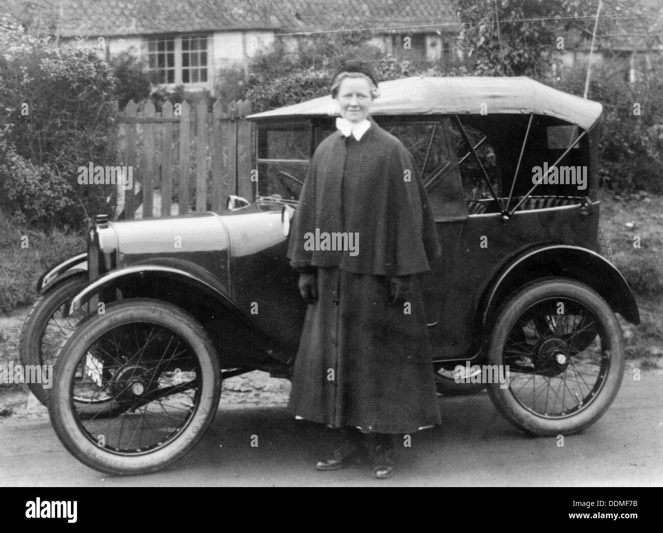 Woman with an Austin Seven, c1923. Artist: Unknown Stock Photo