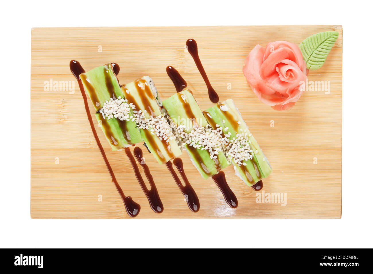 Asian food sushi on wooden plate isolated on white background Stock