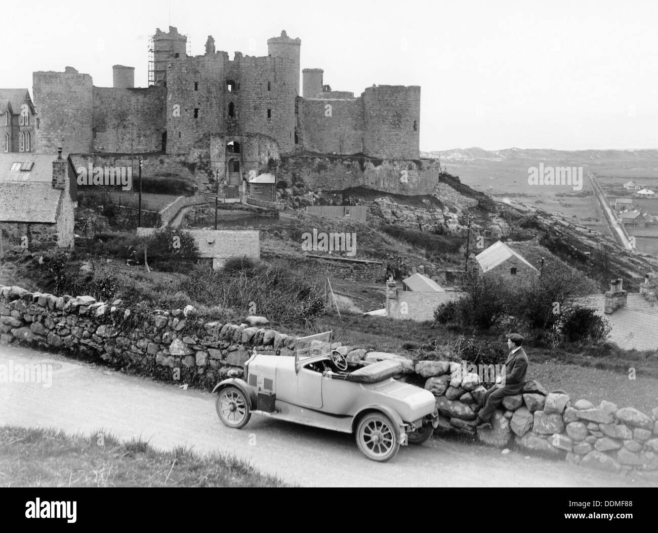 A Singer car in front of Harlech Castle, Wales, early 1920s. Artist: Unknown Stock Photo