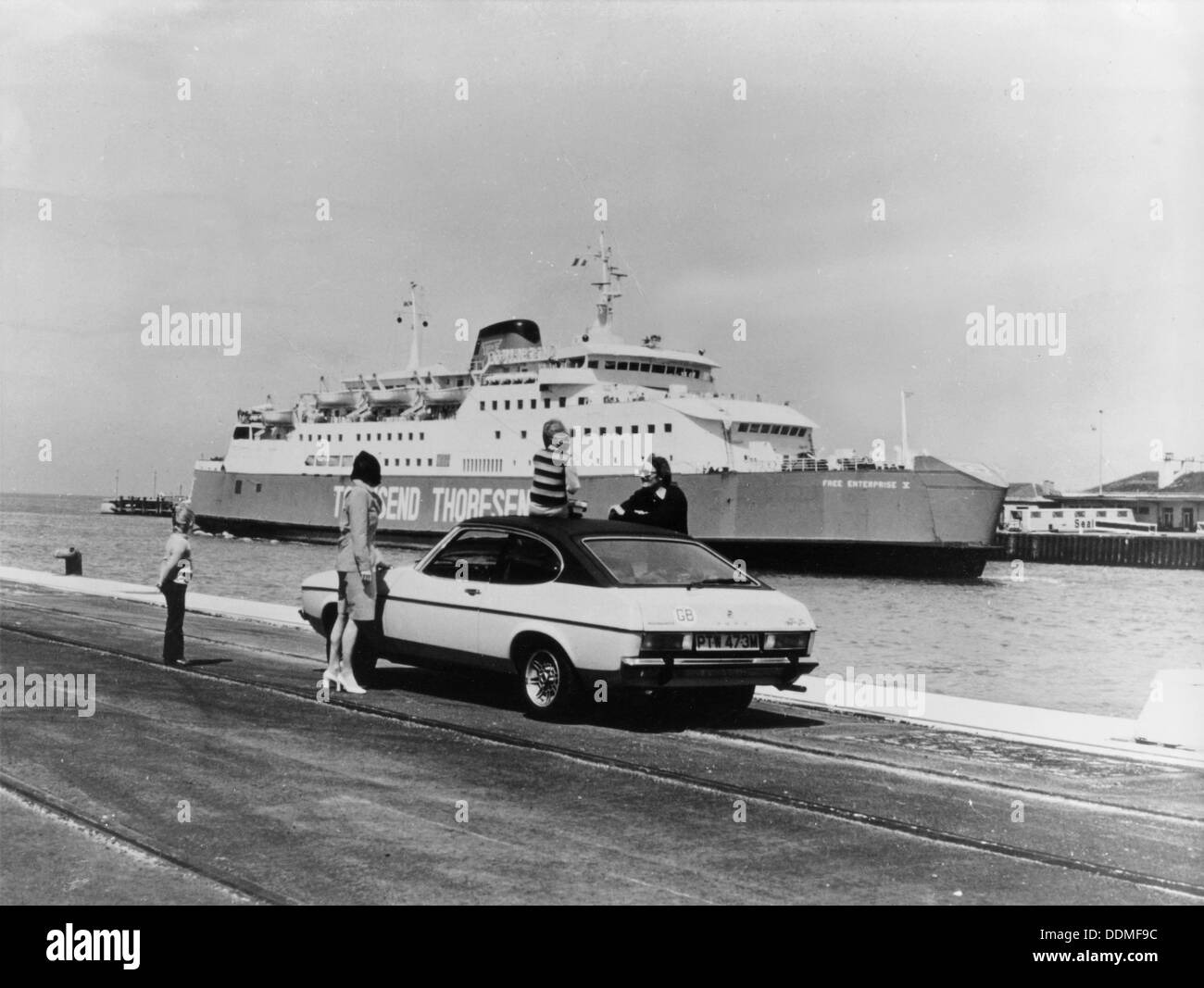 A 1974 Ford Capri on a quay, in front of a Townsend Thoresen car ferry, 1970s. Artist: Unknown Stock Photo