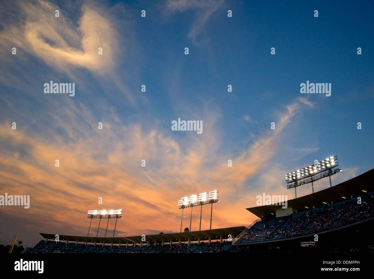 Lights at a stadium at sunset Stock Photo