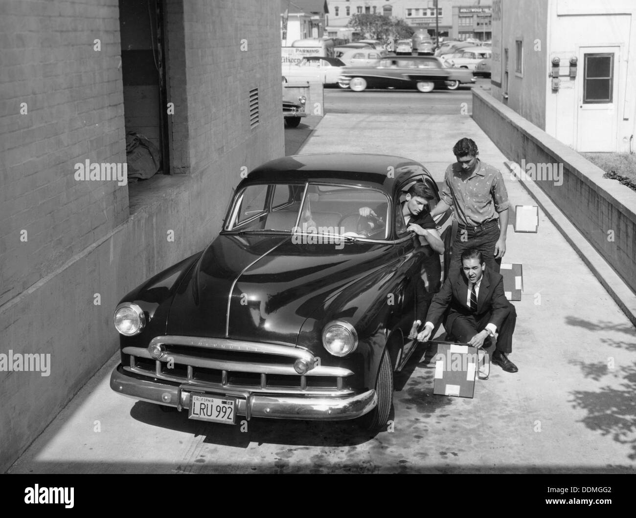 Men with a 1949 customised Chevrolet, (c1949?). Artist: Unknown Stock Photo