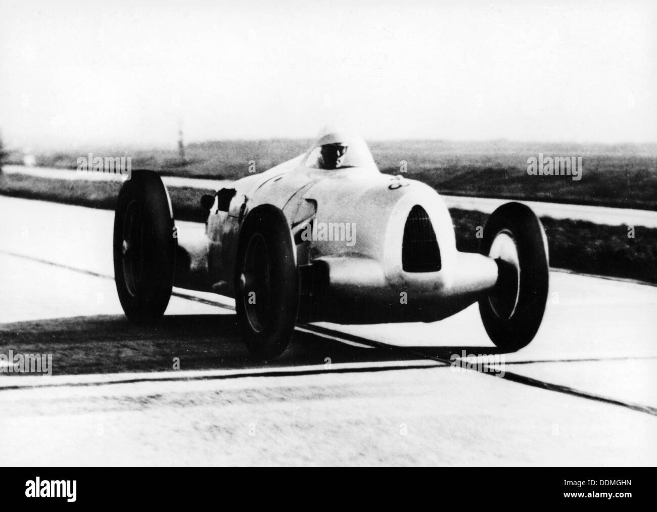 Bernd Rosemeyer in Auto Union record-breaking car, 1937. Artist ...